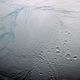 At left, the four tiger stripes at the south pole of Enceladus.